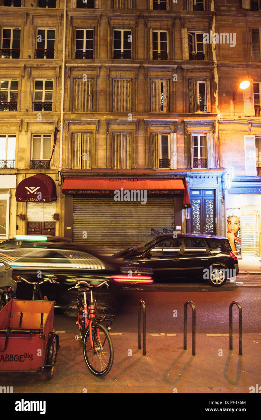 Street scene at night, Paris Stock Photo