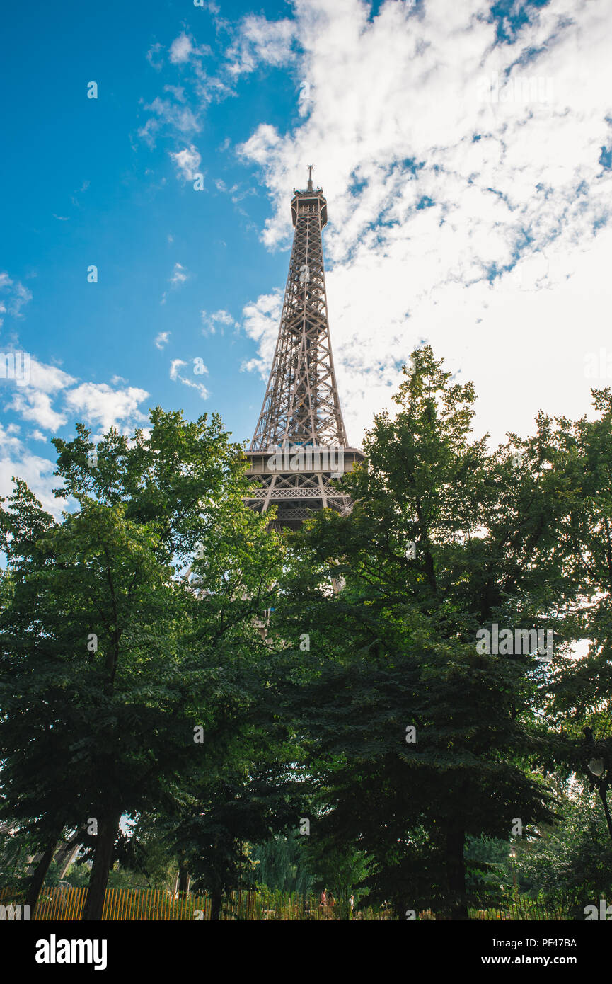 Eiffel Tower with cloudy, blue sky Stock Photo