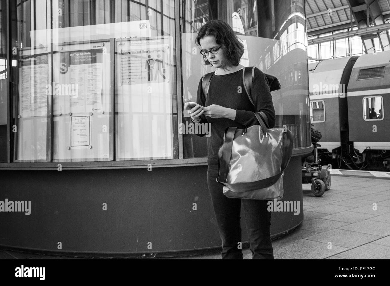 Berlin, Germany, 1st September 2017, view, fof the Station Platforms commuter, checking her, Mobile Phone, S-Bahn, © Peter SPURRIER. Stock Photo