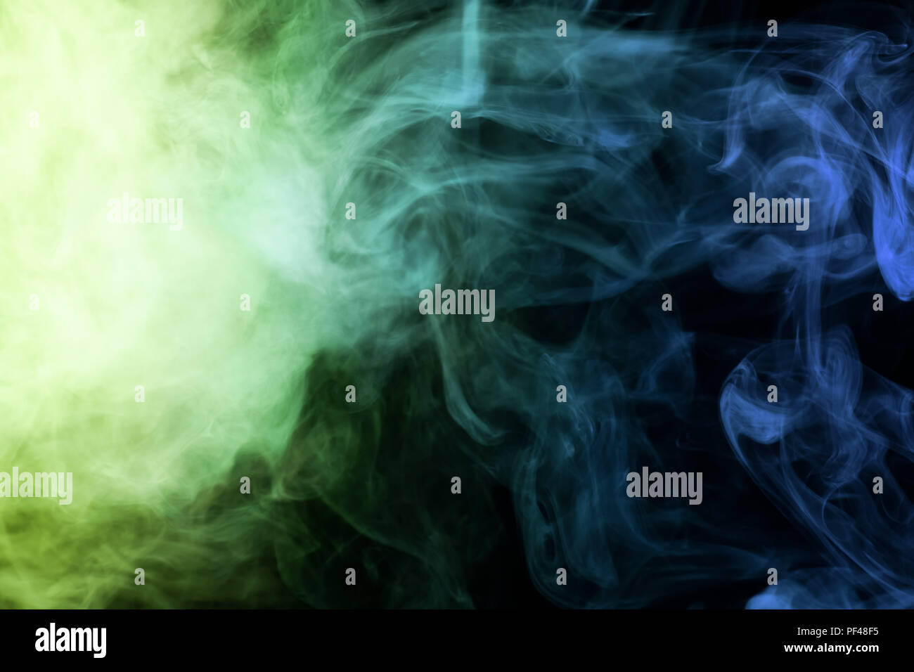 Green and blue smoke on black background Stock Photo - Alamy