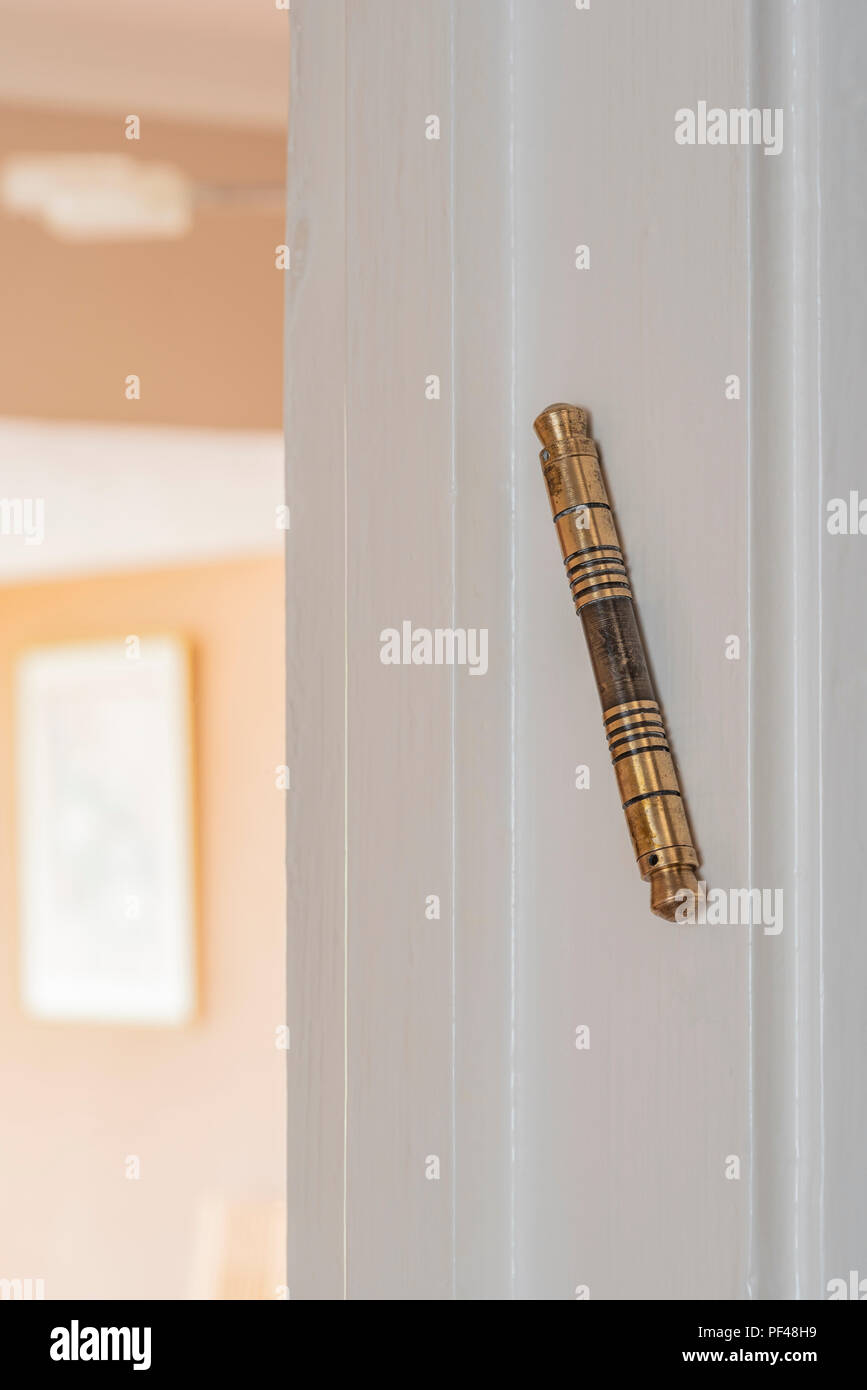 A Mezuzah fixed to an internal door. Jewish tradition states they should be affixed to every doorway of all living rooms. Stock Photo