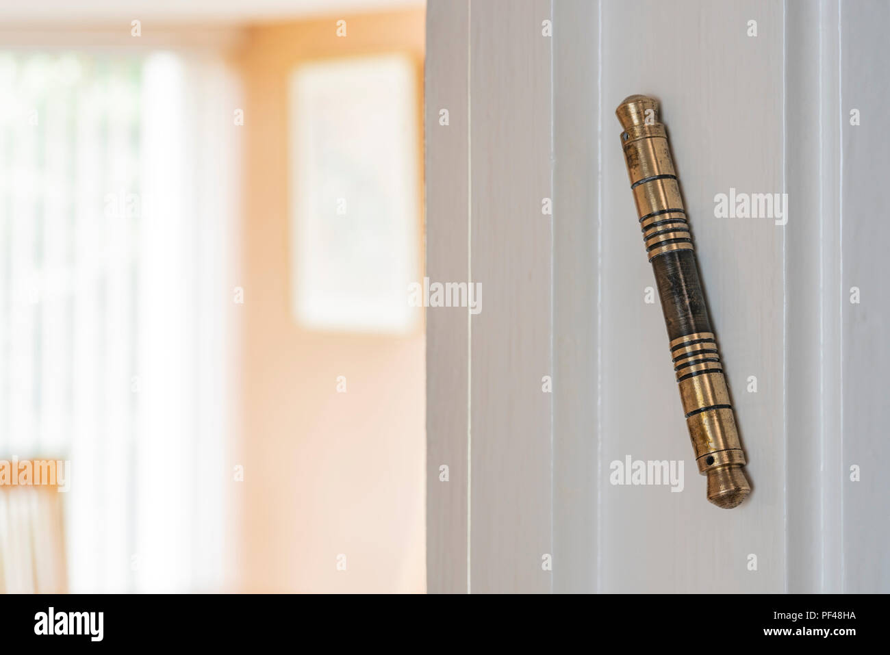 A Mezuzah fixed to an internal door. Jewish tradition states they should be affied to every doorway of all living rooms. Stock Photo