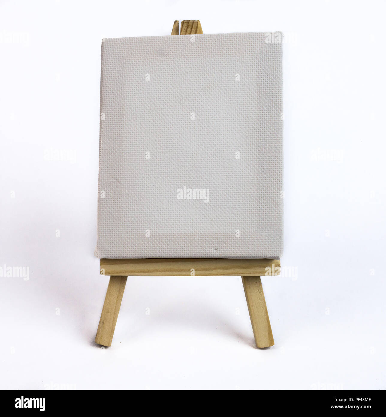 Blank canvas on easel with white background Stock Photo Alamy