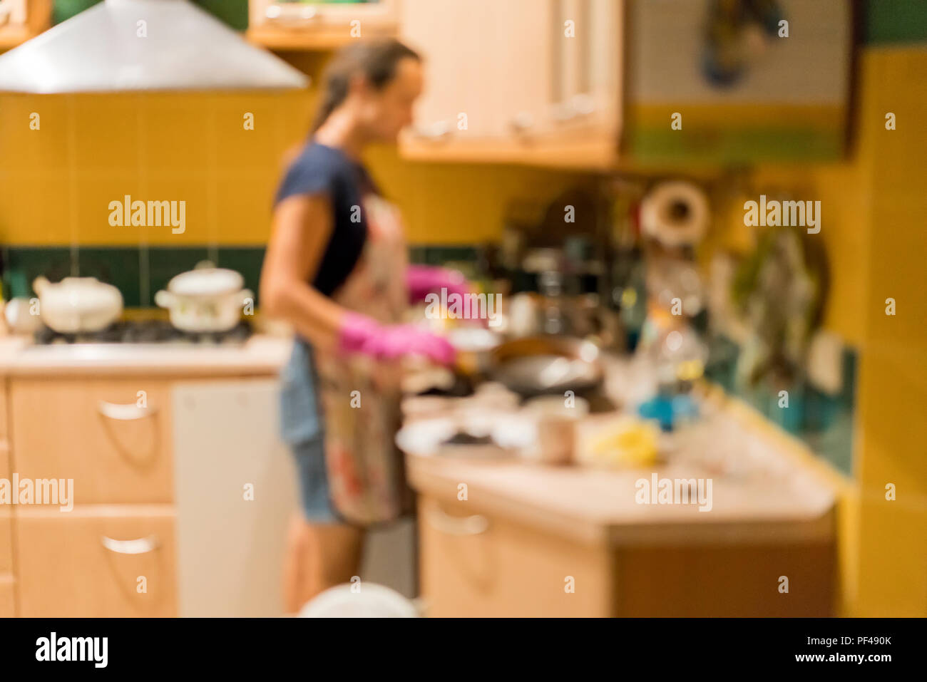 Women in the kitchen are washing dishes. Blurry Stock Photo Alamy