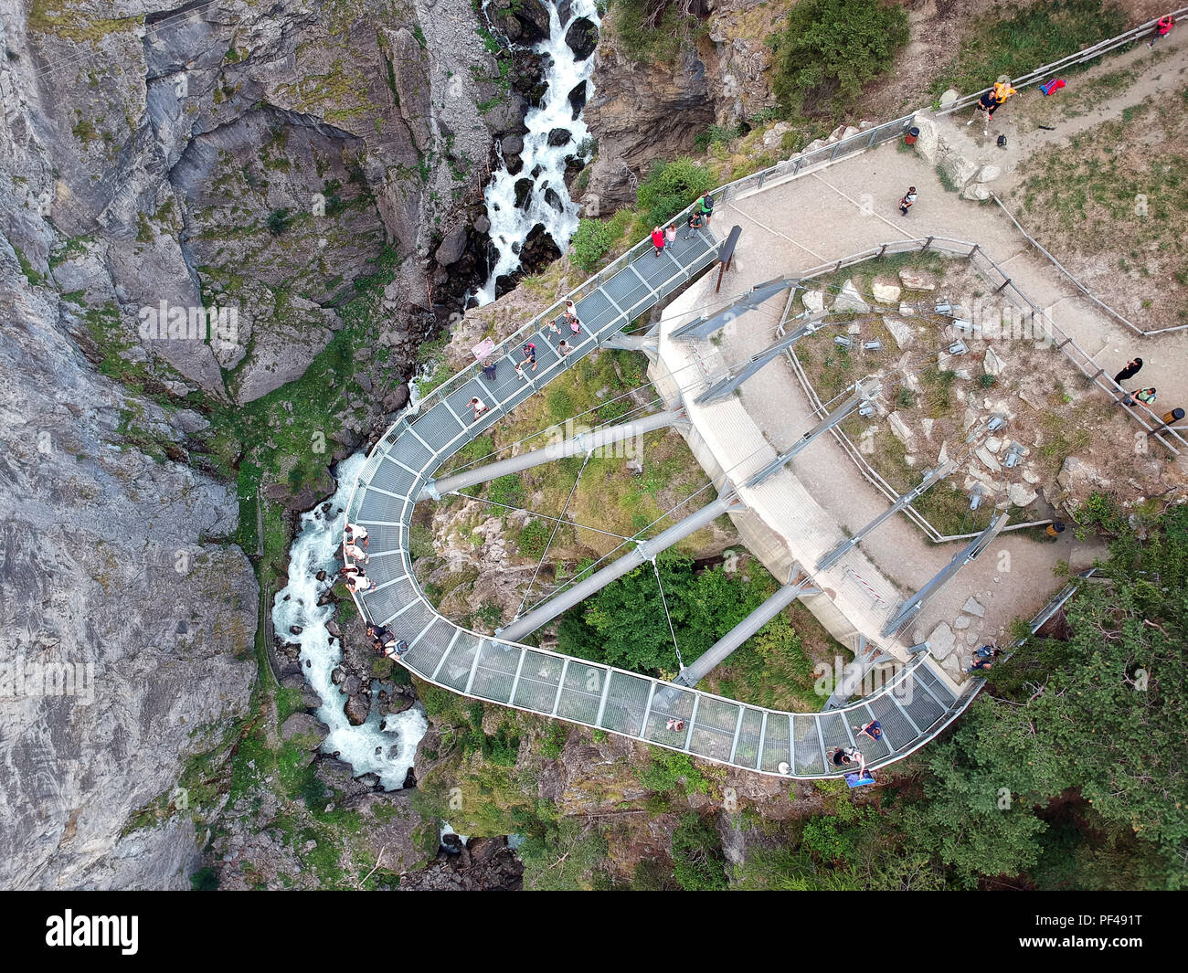 Footbridge suspended over the gorge of Pre-Saint-Didier park - Pre-Saint-Didier, Aosta / Italy Stock Photo