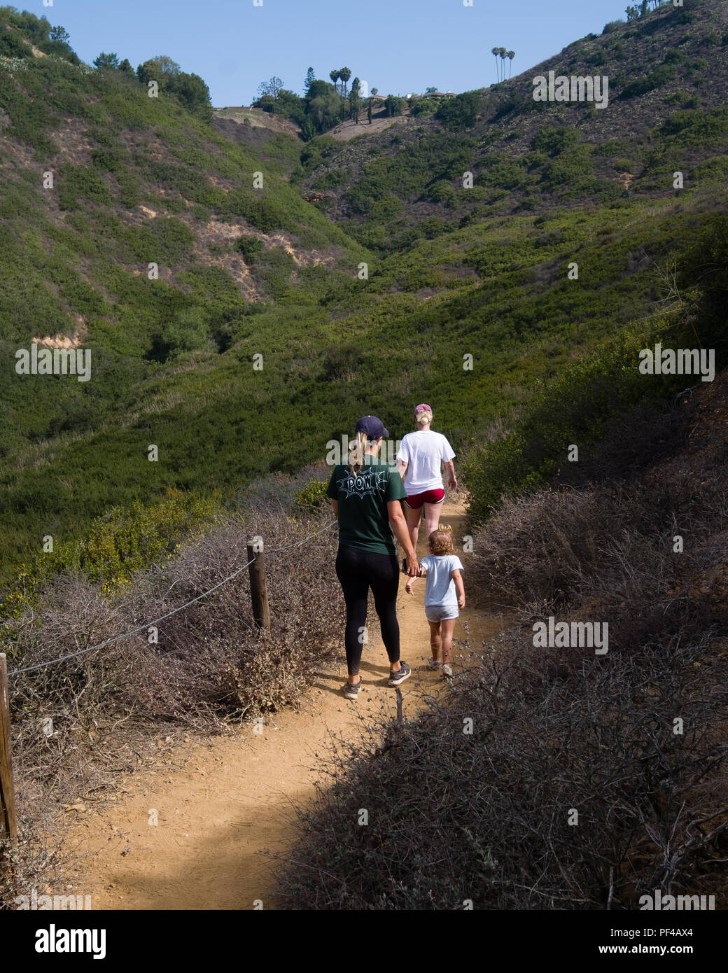 Family enjoying a morning walk on the Mariposa Trail of the Forrestal Nature Reserve in Rancho Palos Verdes, CA Stock Photo