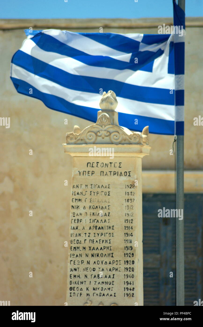 Greece, the island of Anafi.  Peaceful and beautiful now but the war memorial reminds of past tragedy. Stock Photo