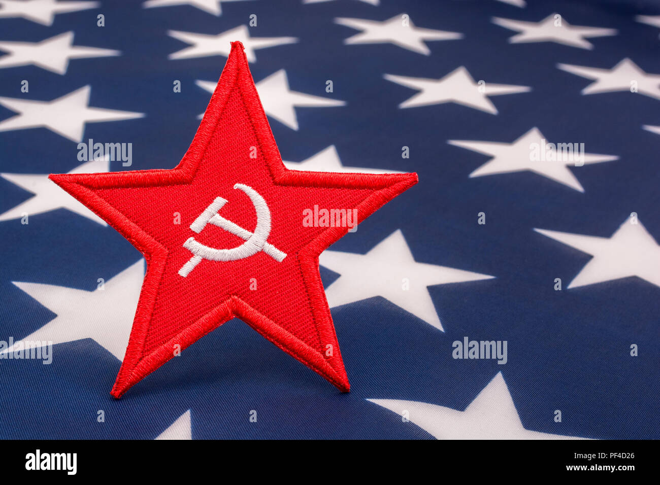 Red Star Hammer and Sickle badge with US / American Stars & Stripes. For US Russia dispute, US Radical Left, Communist America, Democratic Socialists Stock Photo