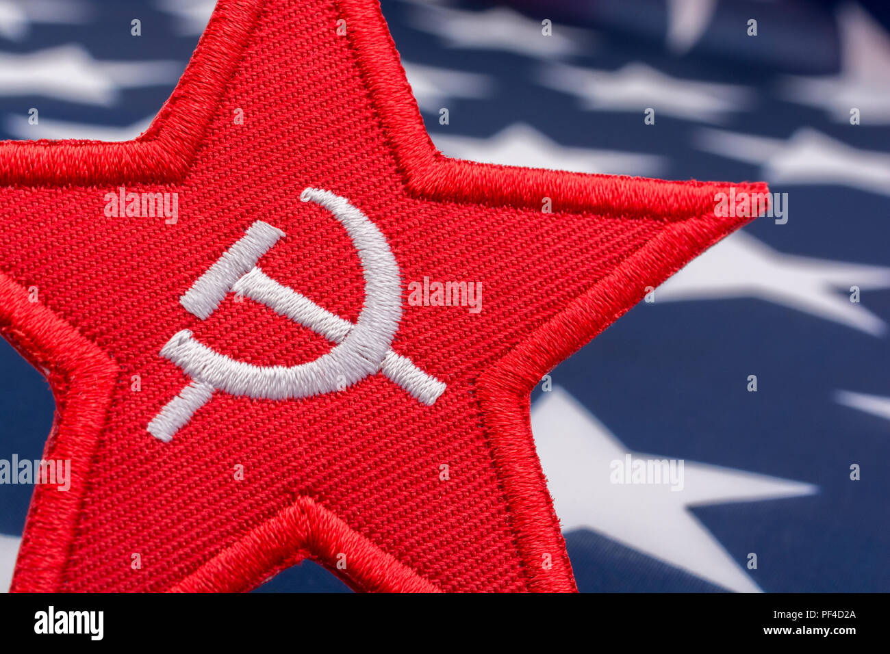 Red Star Hammer and Sickle badge with US / American Stars & Stripes. For US Russia dispute, US Radical Left, Communist America, Democratic Socialists Stock Photo