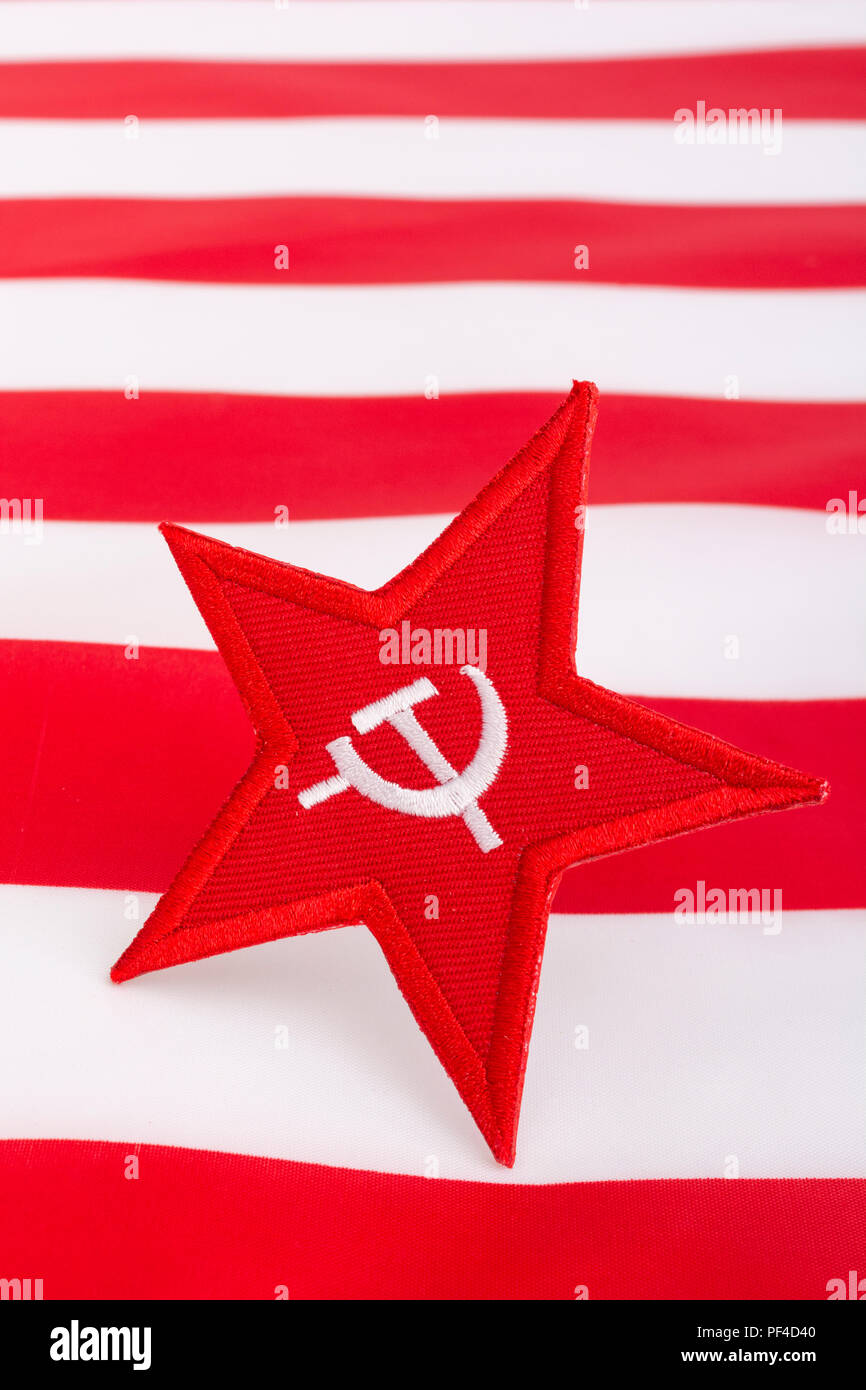 Red Star Hammer and Sickle badge with US / American Stars & Stripes. For US Russia dispute, US Radical Left, Communist America, Democratic Socialists Stock Photo