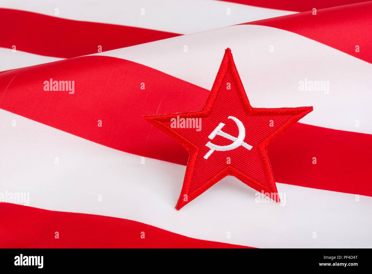 Red Star Hammer and Sickle badge with US / American Stars & Stripes. For US Russia dispute, US Radical Left, Communist America, Democratic Socialists Stock Photo