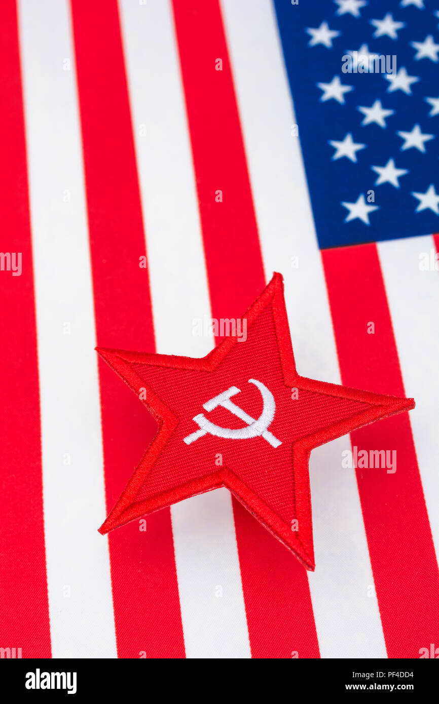 Red Star Hammer and Sickle badge with US / American Stars & Stripes. For US Russia dispute, US Radical Left, Communist America, Democratic Socialists Stock Photo