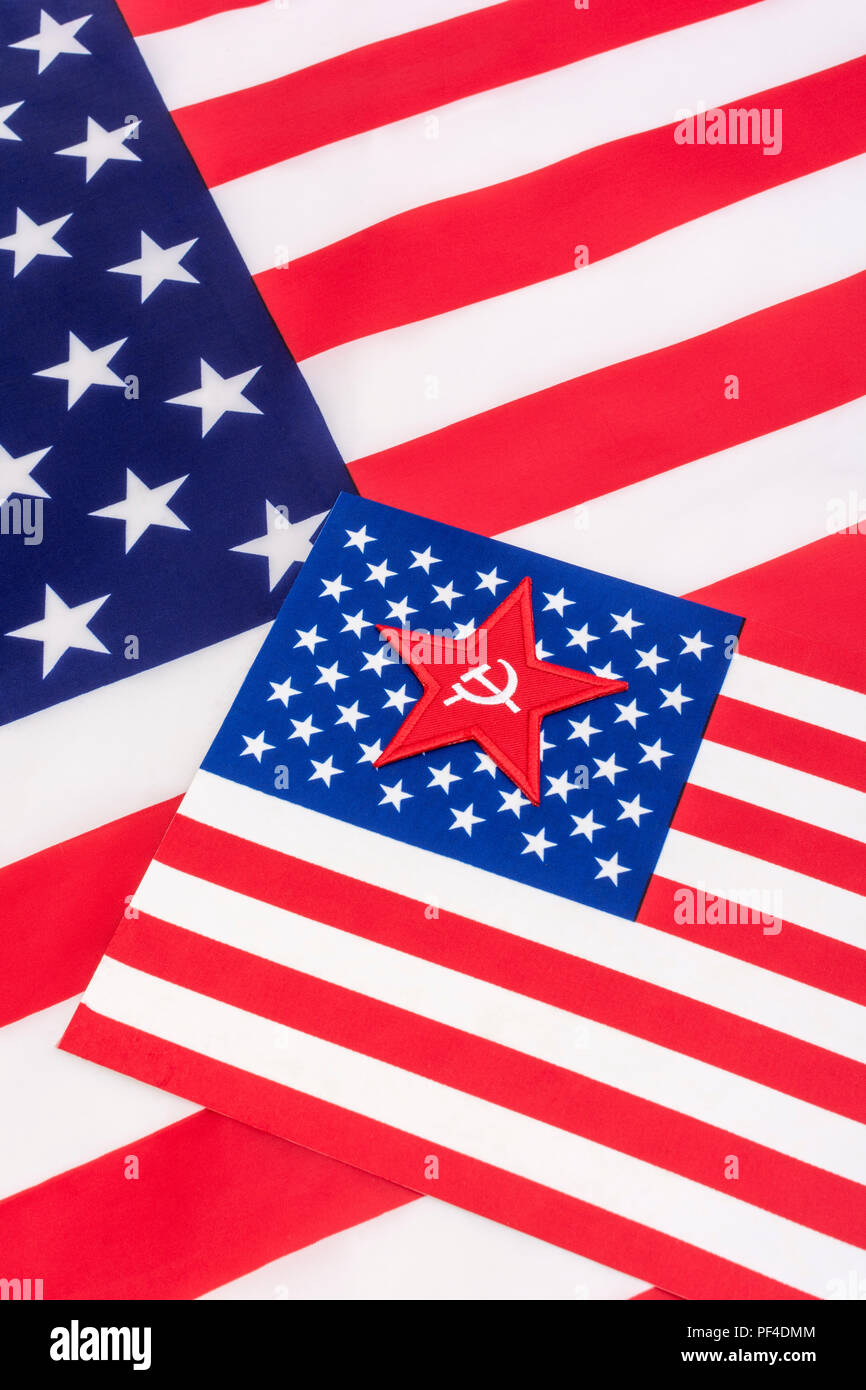 Red Star Hammer and Sickle badge with American Stars & Stripes flag. For US Radical Left, Communist America, Democratic Socialists, American marxism. Stock Photo