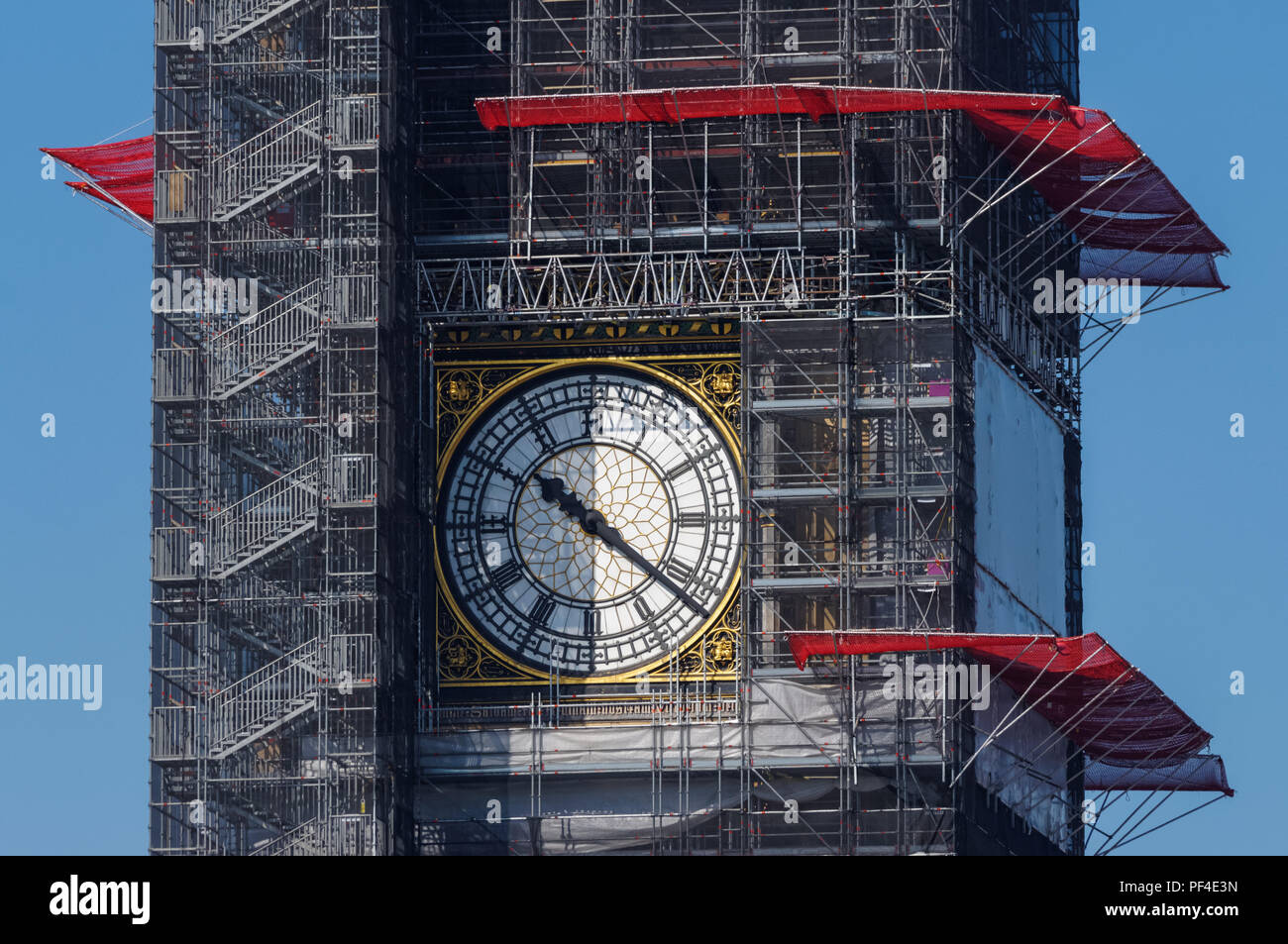 Elizabeth Tower (Big Ben) and the Palace of Westminster covered in scaffolding during maintenance work, London England United Kingdom UK Stock Photo