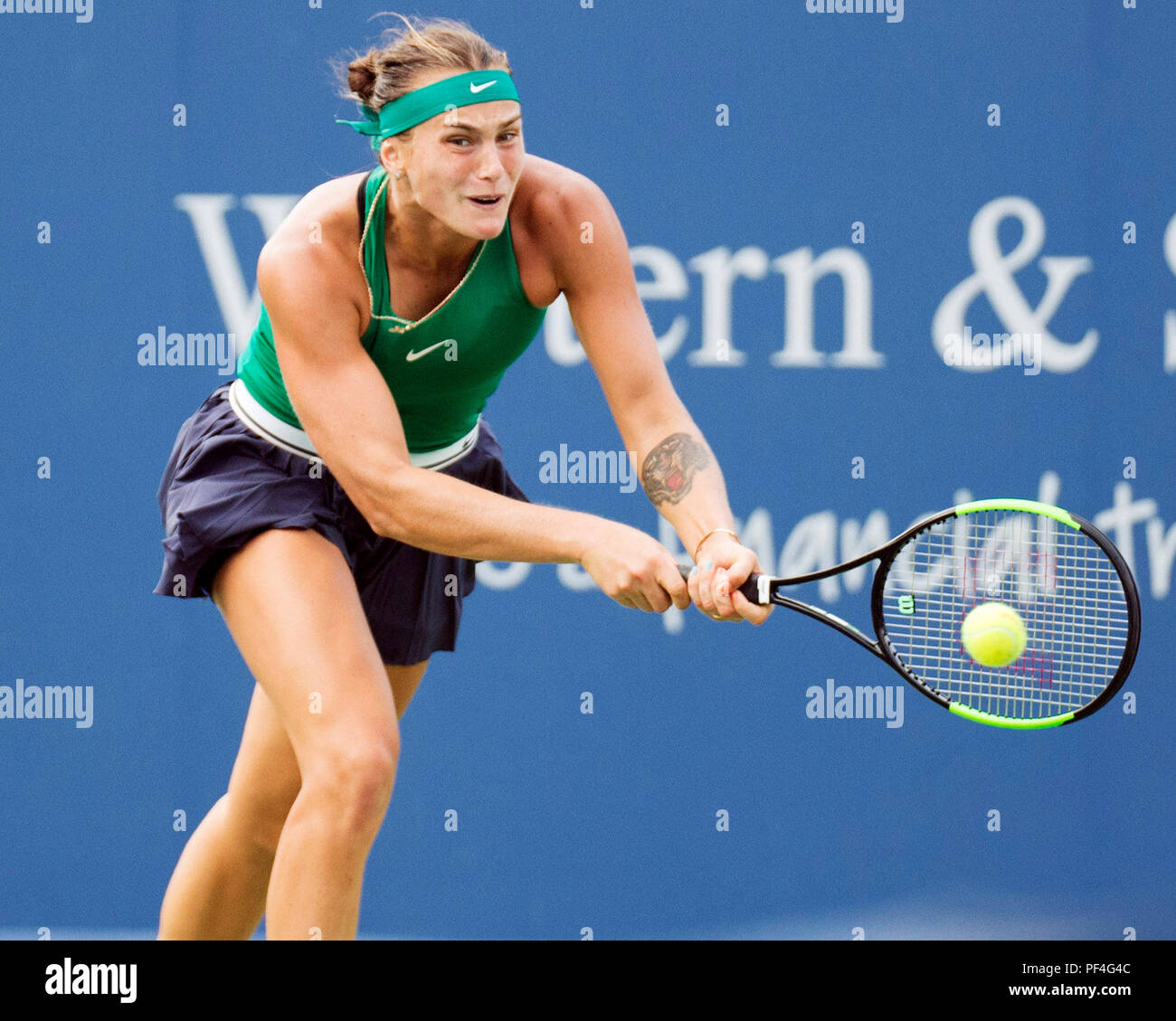 Ohio, USA. 18 August 2018.  Aryna Sabalenka (BLR) hits the ball back to Simona Halep (ROU) at the Western Southern Open in Mason, Ohio, USA. Brent Clark/Alamy Live News Stock Photo