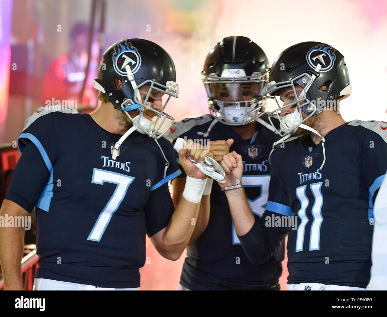 Nashville, USA. 18 August 2018. Tennessee Titans quarterback Blaine Gabbert  (7), Tennessee Titans quarterback Marcus Mariota (8), and Tennessee Titans  quarterback Luke Falk (11) get ready to head to the field during