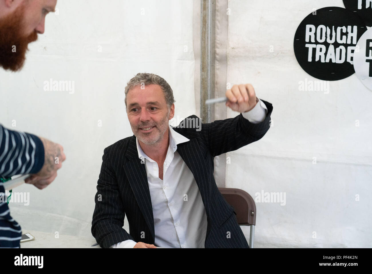 Glanusk Park, Brecon, Wales, 18th August 2018.  Day Two of the Green Man music festival in the Brecon Beacons Mountains in Wales. Pictured: Baxter Dury in the signing area. Credit: Rob Watkins/Alamy Live News Stock Photo