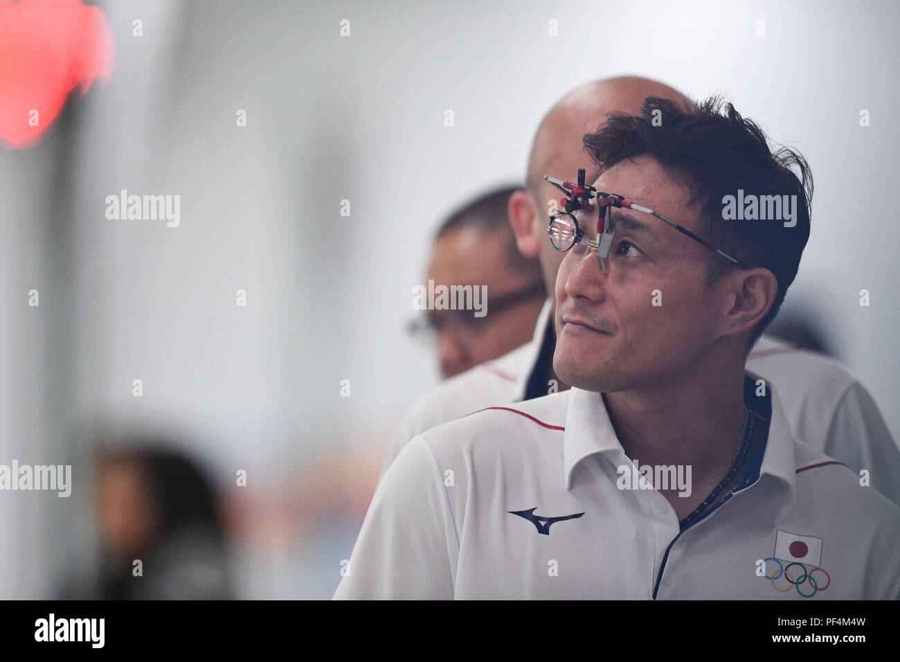 Palembang. 19th Aug, 2018. Matsuda Tomoyuki of Japan reacts during the 10m Air Pistol Mixed Team Qualification at the 18th Asian Games in Palembang, Indonesia Aug. 19, 2018. Credit: Liu Ailun/Xinhua/Alamy Live News Stock Photo
