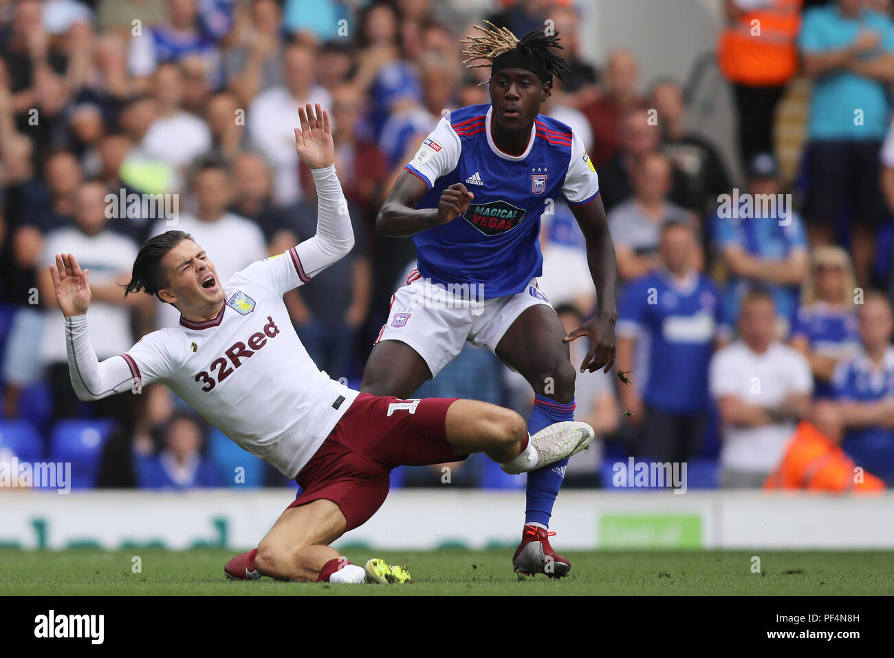 Ipswich, UK.. 18th Aug, 2018. Jack Grealish of Aston Villa goes to ground after a challenge from Trevoh Chalobah of Ipswich Town - Ipswich Town v Aston Villa, Sky Bet Championship, Portman Road, Ipswich - 18th August 2018 Credit: Richard Calver/Alamy Live News Stock Photo