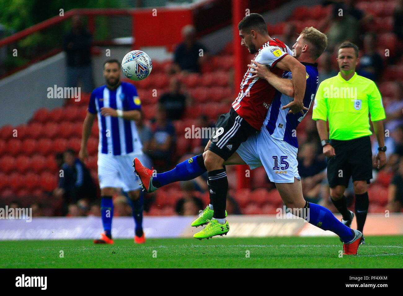 London, UK. 19th Aug, 2018. Editorial use only, license required for commercial use. No use in betting, games or a single club/league/player publications. Neal Maupay of Brentford (R) is tackled by Tom Lees of Sheffield Wednesday (L). EFL Skybet championship match, Brentford v Sheffield Wednesday at Griffin Park stadium in London on Sunday 19th August 2018.  this image may only be used for Editorial purposes. Editorial use only, license required for commercial use. No use in betting, games or a single club/league/player publications. pic by Steffan Bowen/Andrew Orchard sports photography/Alamy Stock Photo
