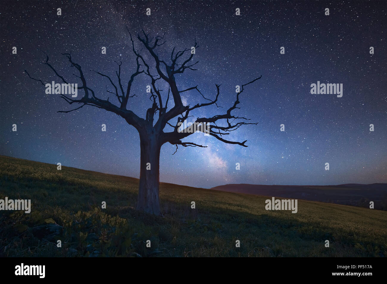 Stunning vibrant Milky Way composite image over landscape of Beautiful ...
