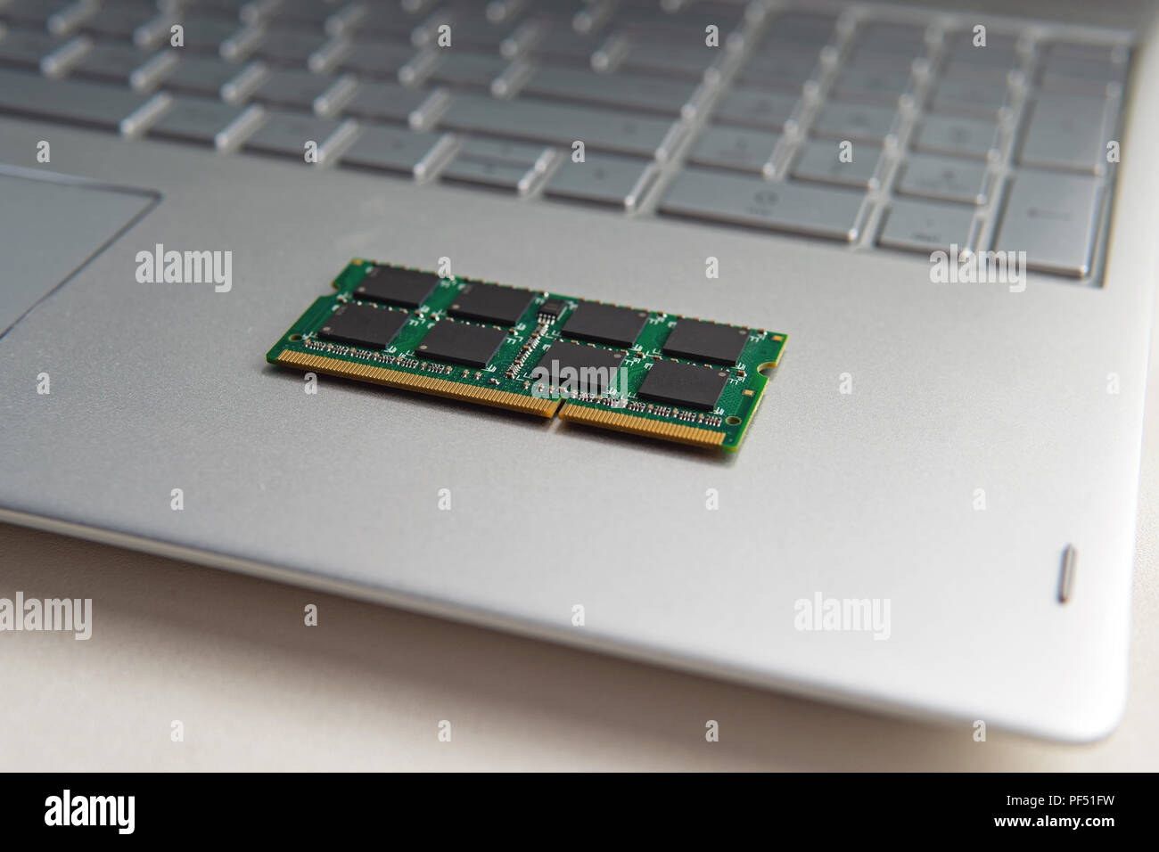 DDR3 sodimm RAM memory card module in black laptop closeup. upgrade ultrabook Stock Photo