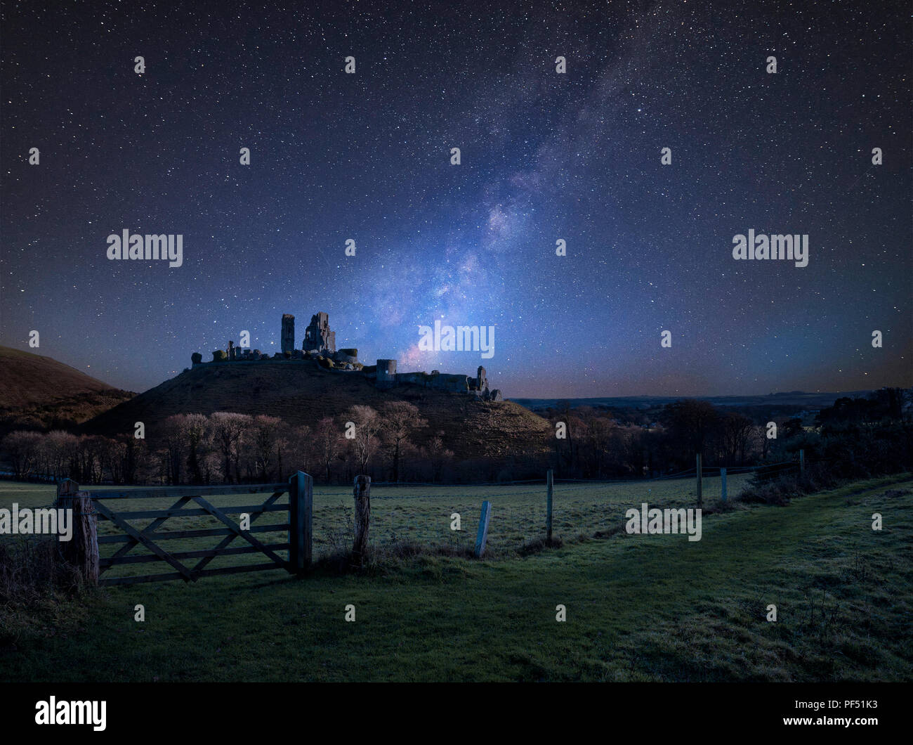 Stunning vibrant Milky Way composite image over landscape of Medieval ...