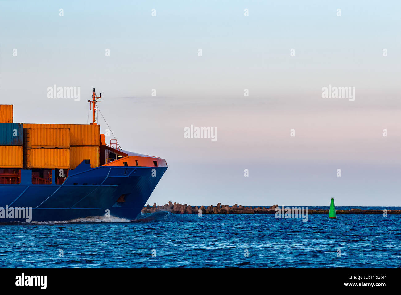 Blue container ship. Global logistics and merchandise transfer Stock