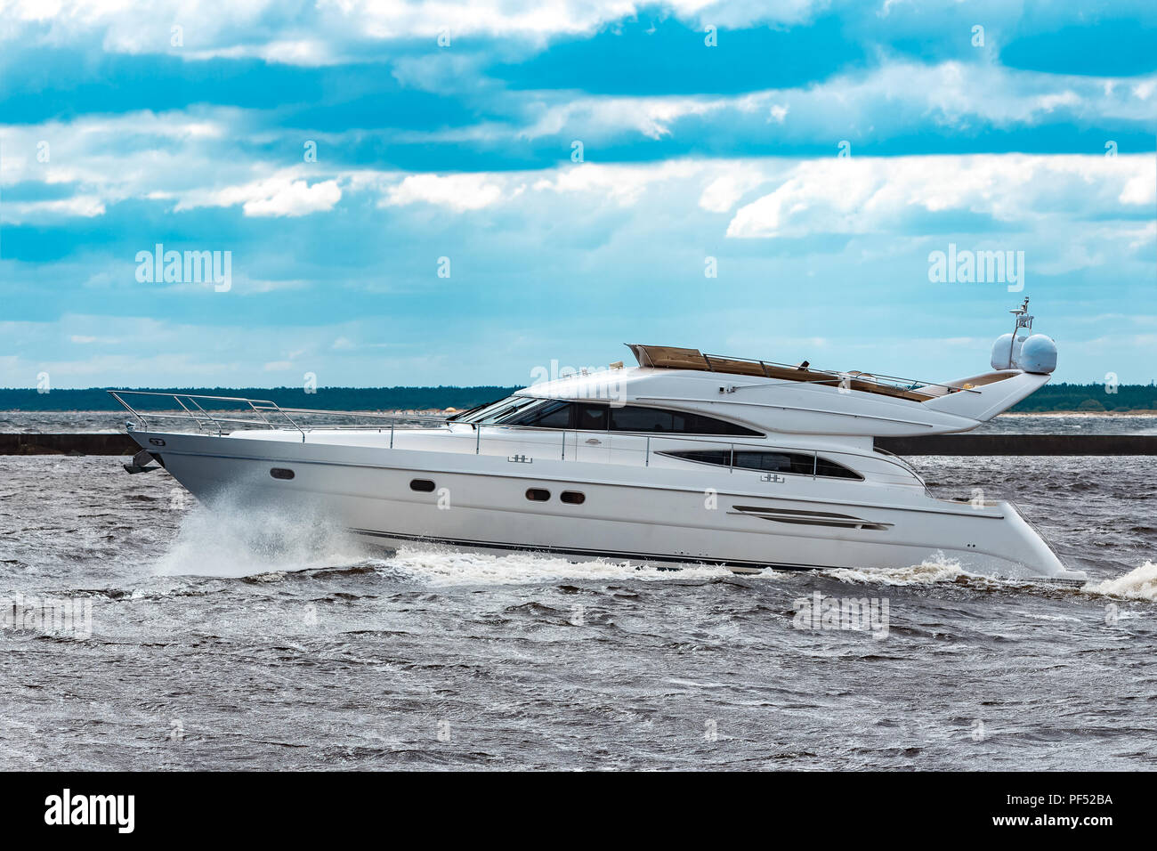 White speed boat moving fast to the Baltic sea. Water sport Stock Photo ...