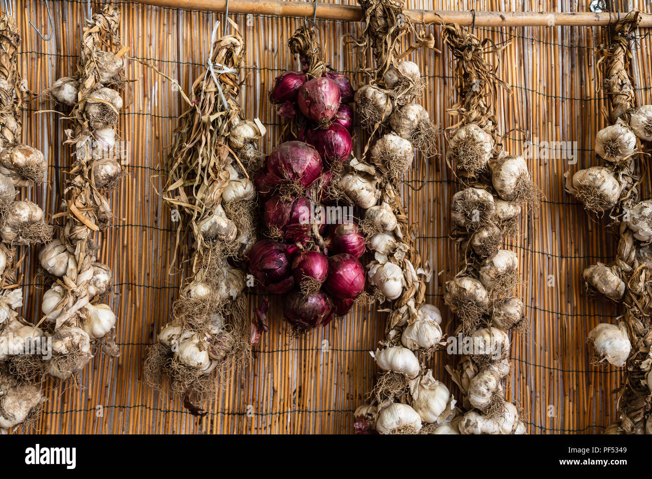 Red onions and garlic in a market stall, Calabria, italy Stock Photo