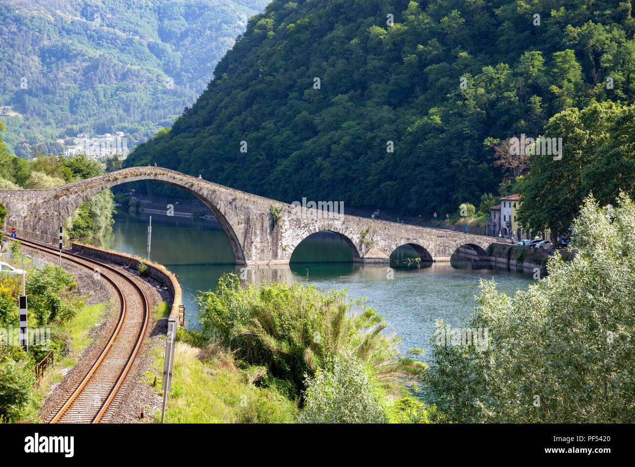 The odd five-arched bridge of Borgo a Mozzano (Tuscany - Italy) built on the Serchio river. Stock Photo