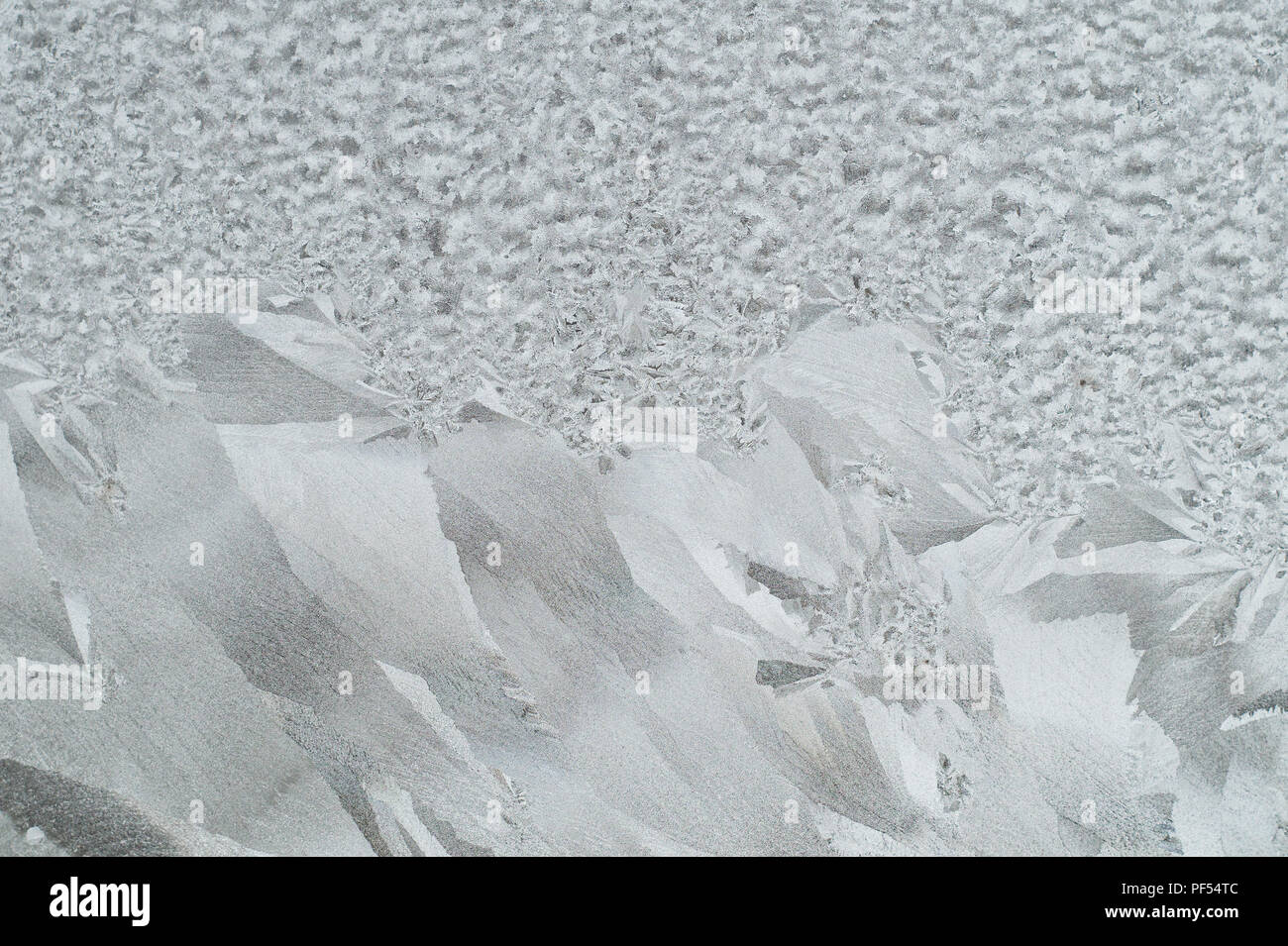Frozen ice patterns on glass Stock Photo - Alamy