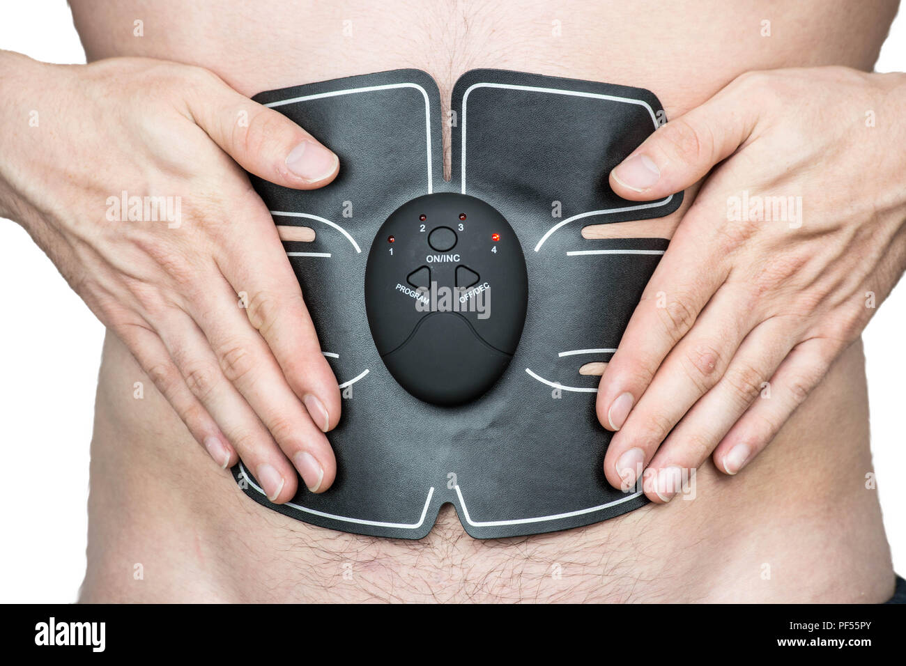 Male athlete wearing a electric ab muscle stimulator doing abs exercise
