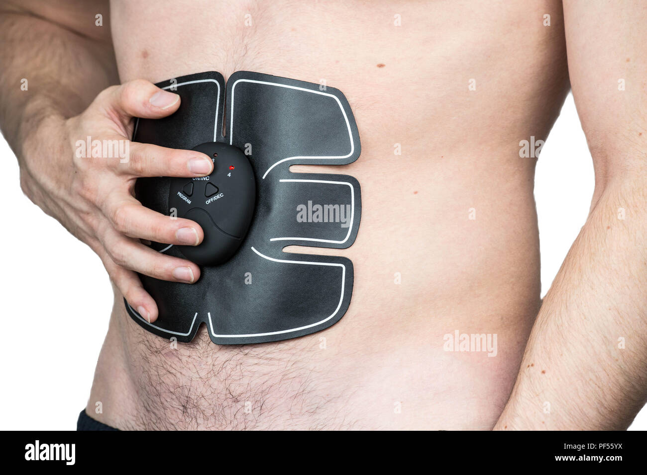 Male athlete wearing a electric ab muscle stimulator doing abs exercise