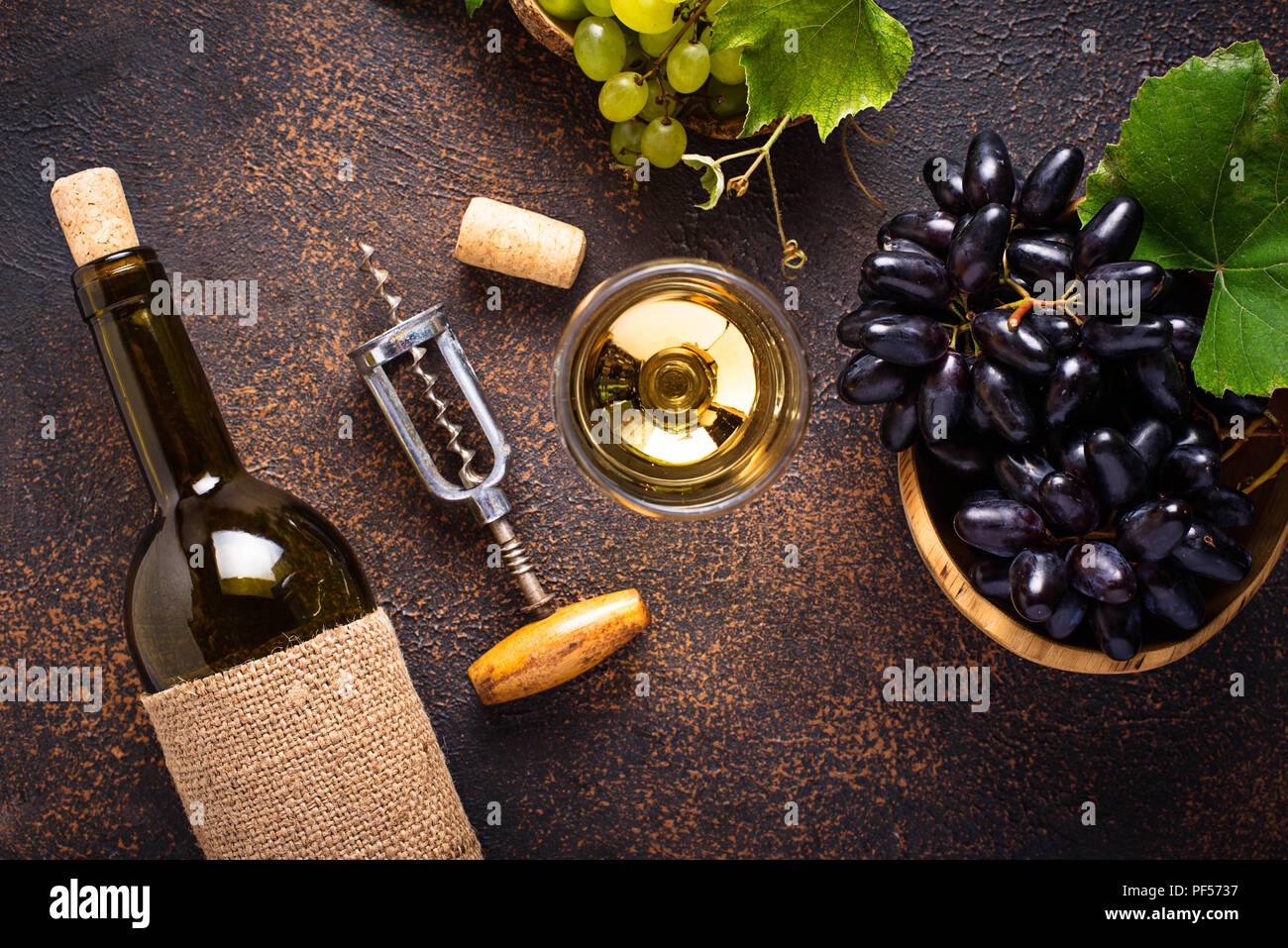 Grape, wine and vintage corkscrew Stock Photo