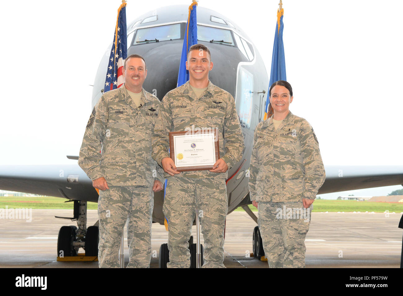 Jerry Ridenour Senior Airman Calum Ridenour, from the 164th Airlift Squadron, receives ...