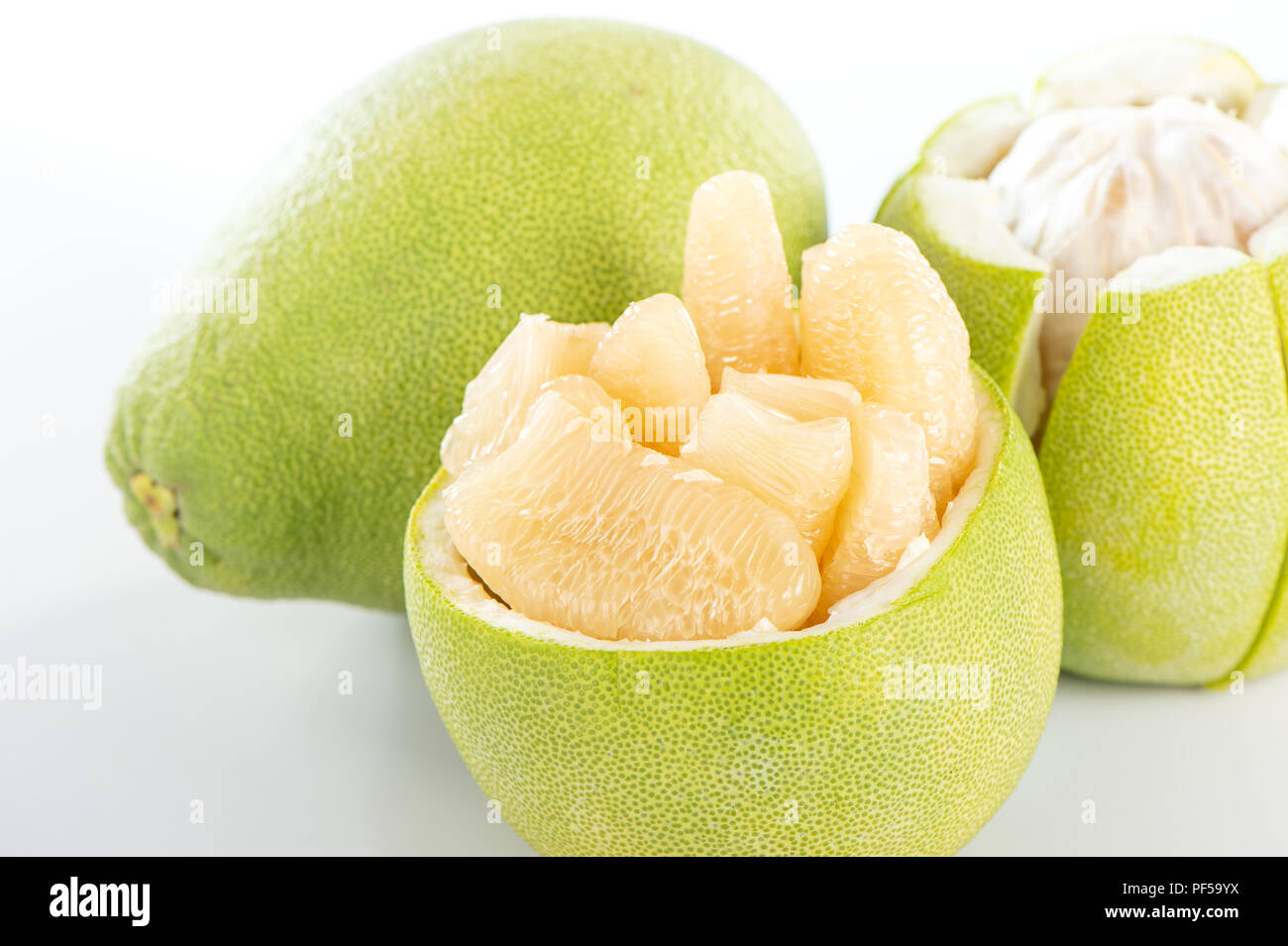 fresh and peeled pomelo(shaddock), grapefruit with slices isolated on