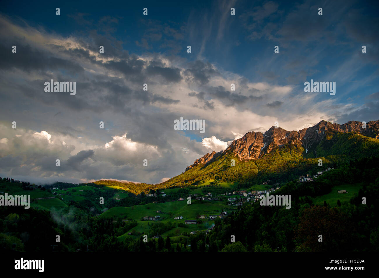mountain in the clouds after the storm with rainbow Stock Photo - Alamy