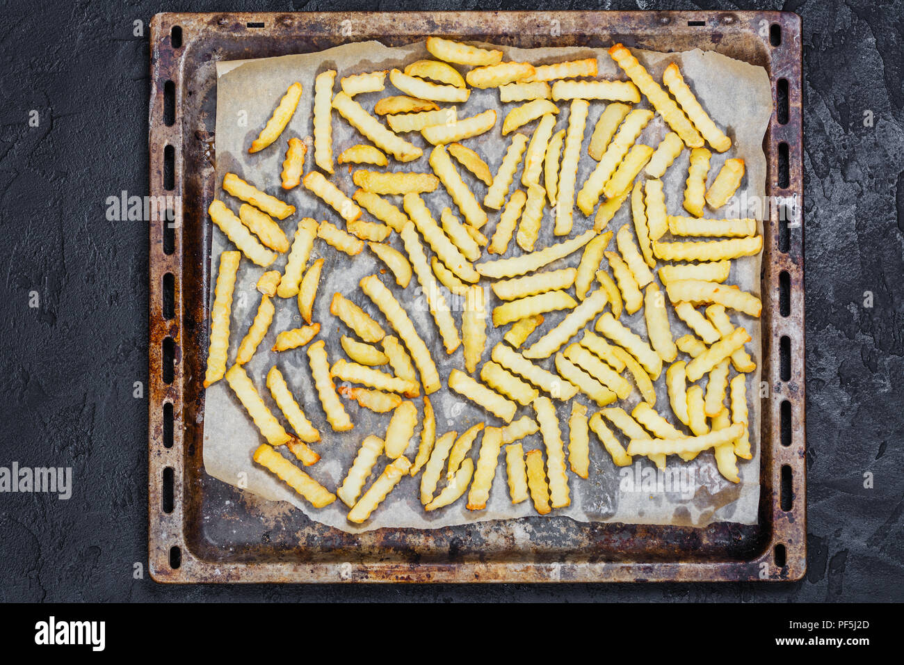 French fries on baking sheet Stock Photo Alamy