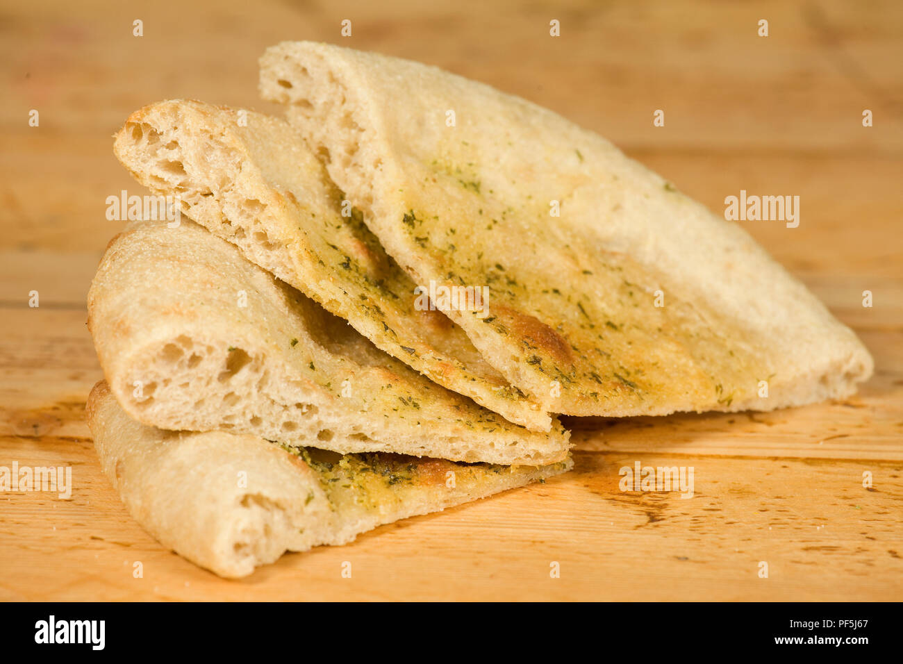 Sliced flat bread on table Stock Photo