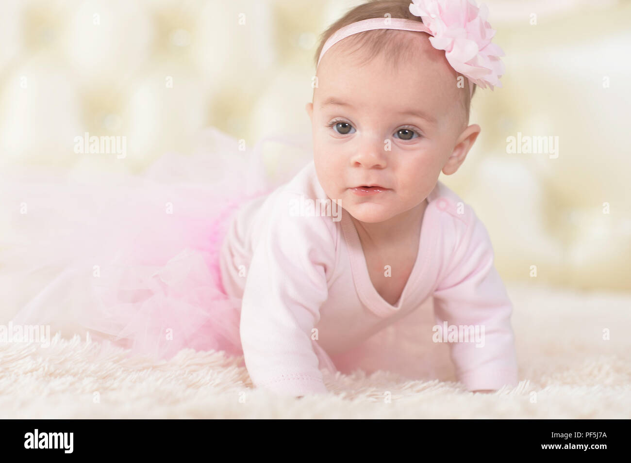 Portrait of a cute charming girl in pink dress Stock Photo - Alamy