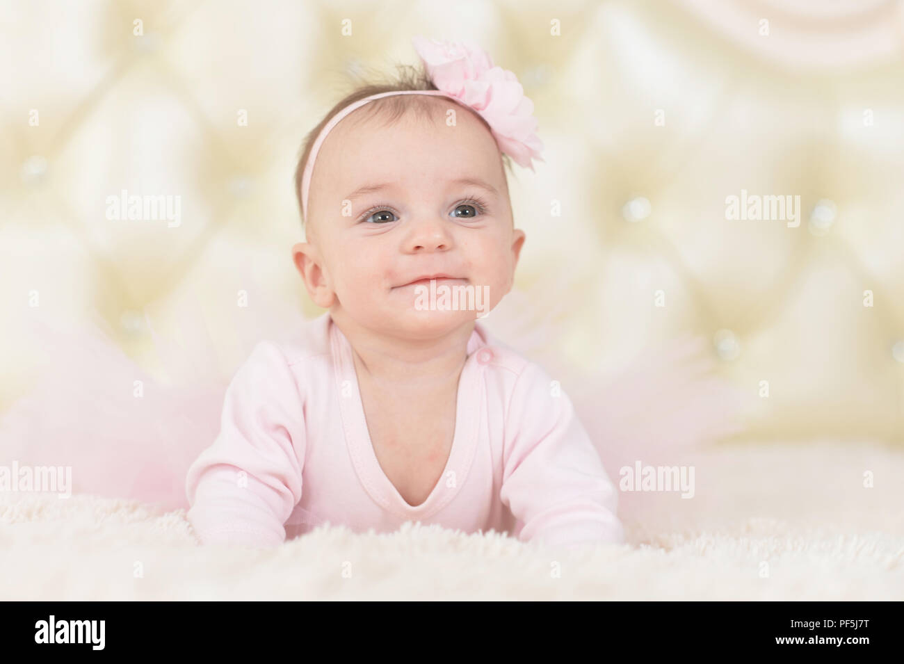 Portrait of a cute charming girl in pink dress Stock Photo - Alamy