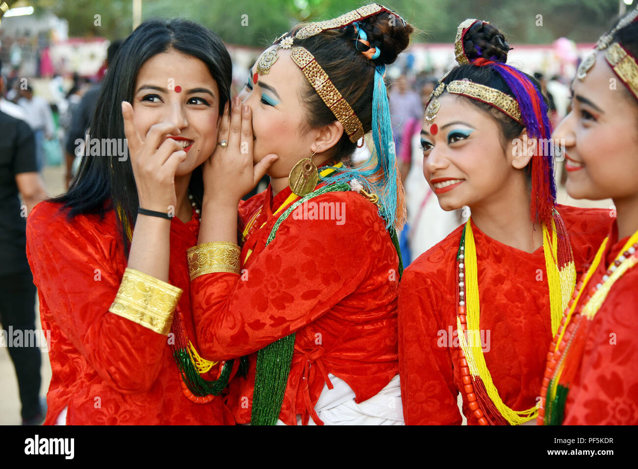 Gandhinagar, India - March 9, 2018: Sikkim girls dressed in traditional attire having fun during Sanskruti Kunj Vasantotsav fair in Gandhinagar. Stock Photo