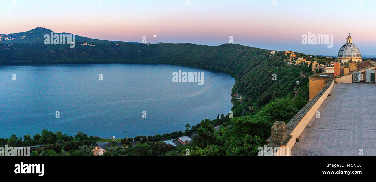 Full moon and sunset on Albano lake as seen from the Specola Vaticana Observatory terrace Stock Photo
