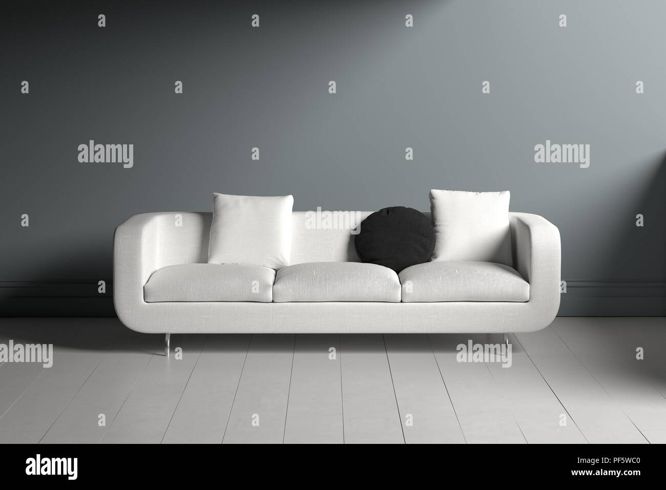 Lone White Couch With Square And Circular Black Pillows Sitting In
