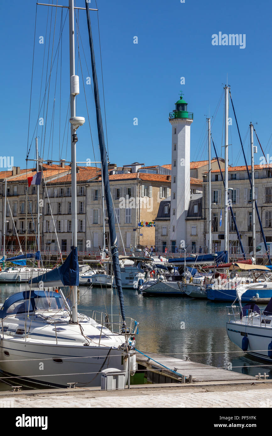 Lighthouse and marina in the Vieux Port of La Rochelle on the coast of the Poitou-Charentes region of France. Stock Photo