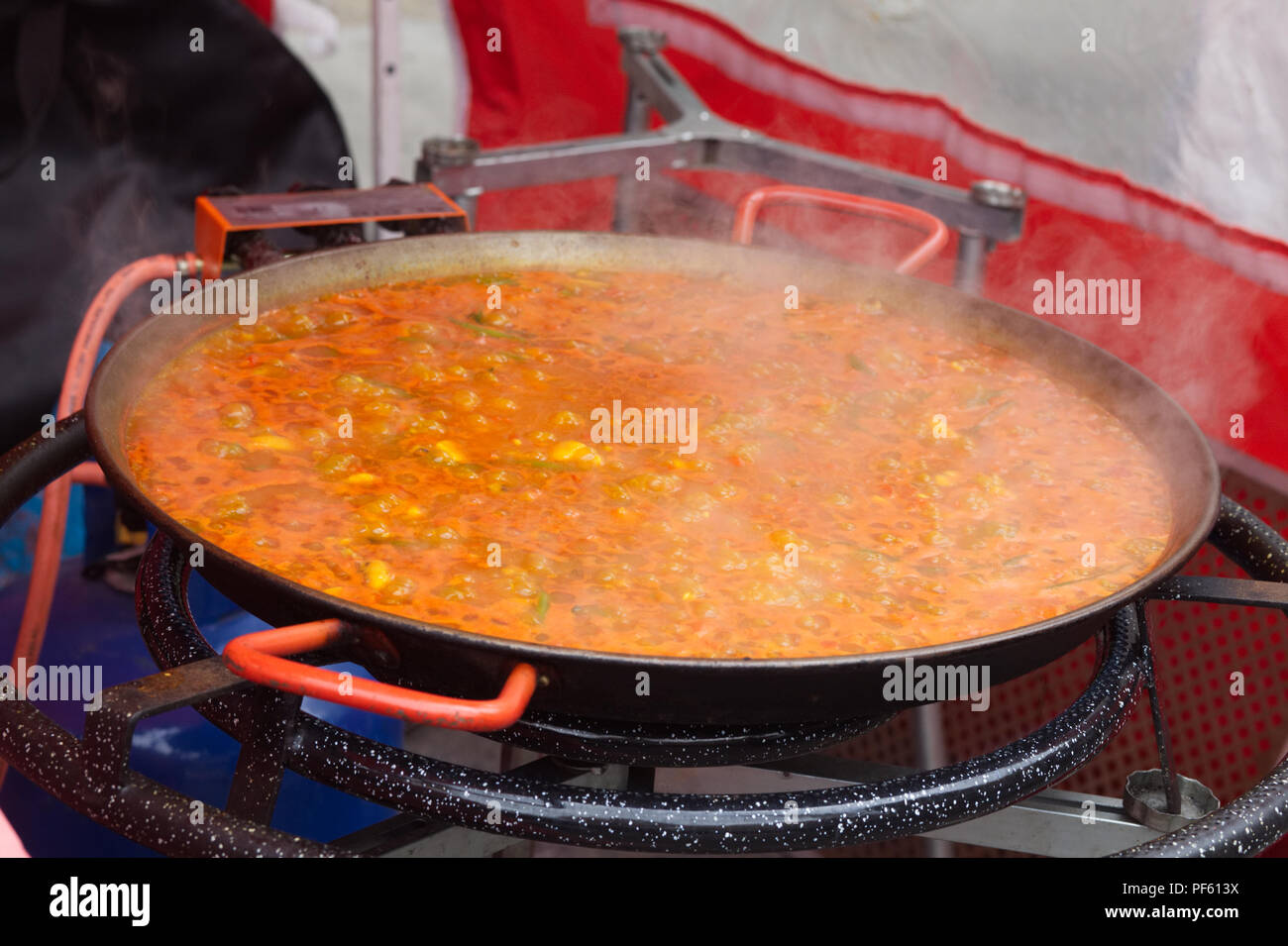 Bubbling red thai curry on a gas ring hi-res stock photography and 