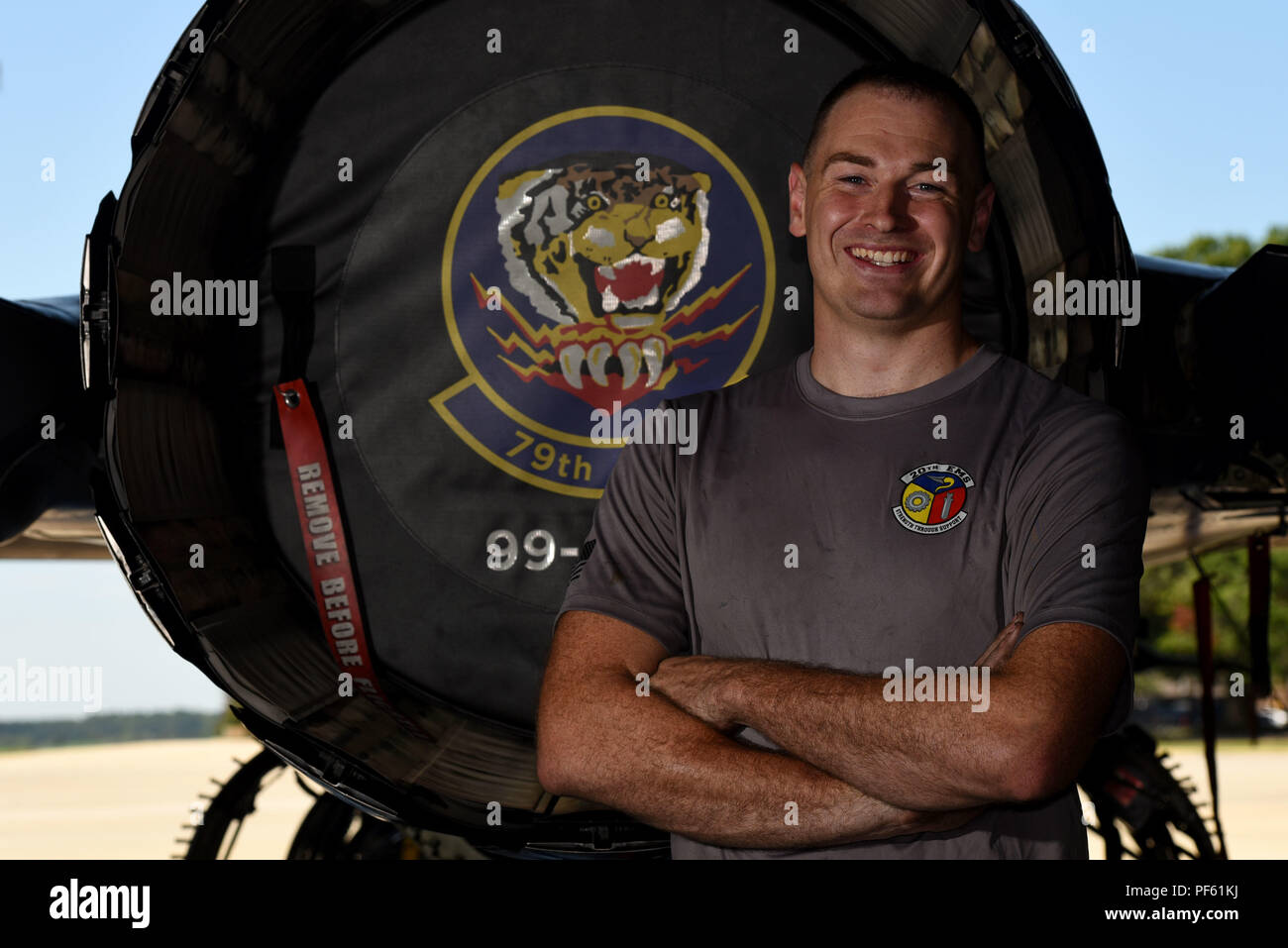 U.S. Air Force Airman 1st Class Codey Martin, 20th Equipment Maintenance Squadron tactical aircraft maintainer, stands next to an F-16CM Fighting Falcon at Shaw Air Force Base, S.C., Aug. 10, 2018. Martin and other Airmen from across the base received the opportunity to share their ideas of what it means to serve in the Air Force. (U.S. Air Force photo by Senior Airman Kathryn R.C. Reaves) Stock Photo