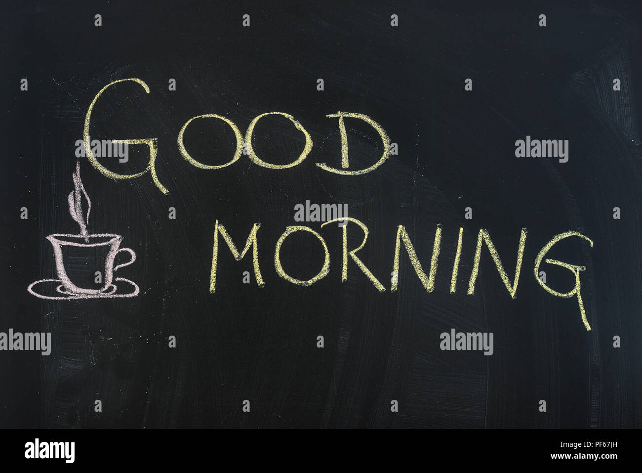 Good morning written on black board. Stock Photo
