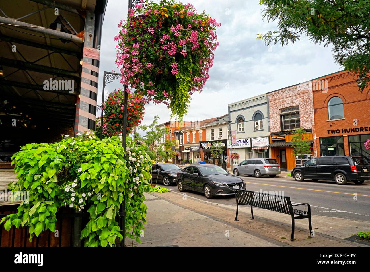 Main Street in downtown Milton time lapse with restaurants, shops and business buildings Stock Photo